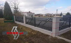 metal fences between concrete posts